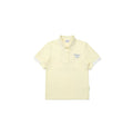 Malbon women's quick-dry breathable golf polo in pale yellow with white collar tipping and cursive Malbon Golf embroidery
