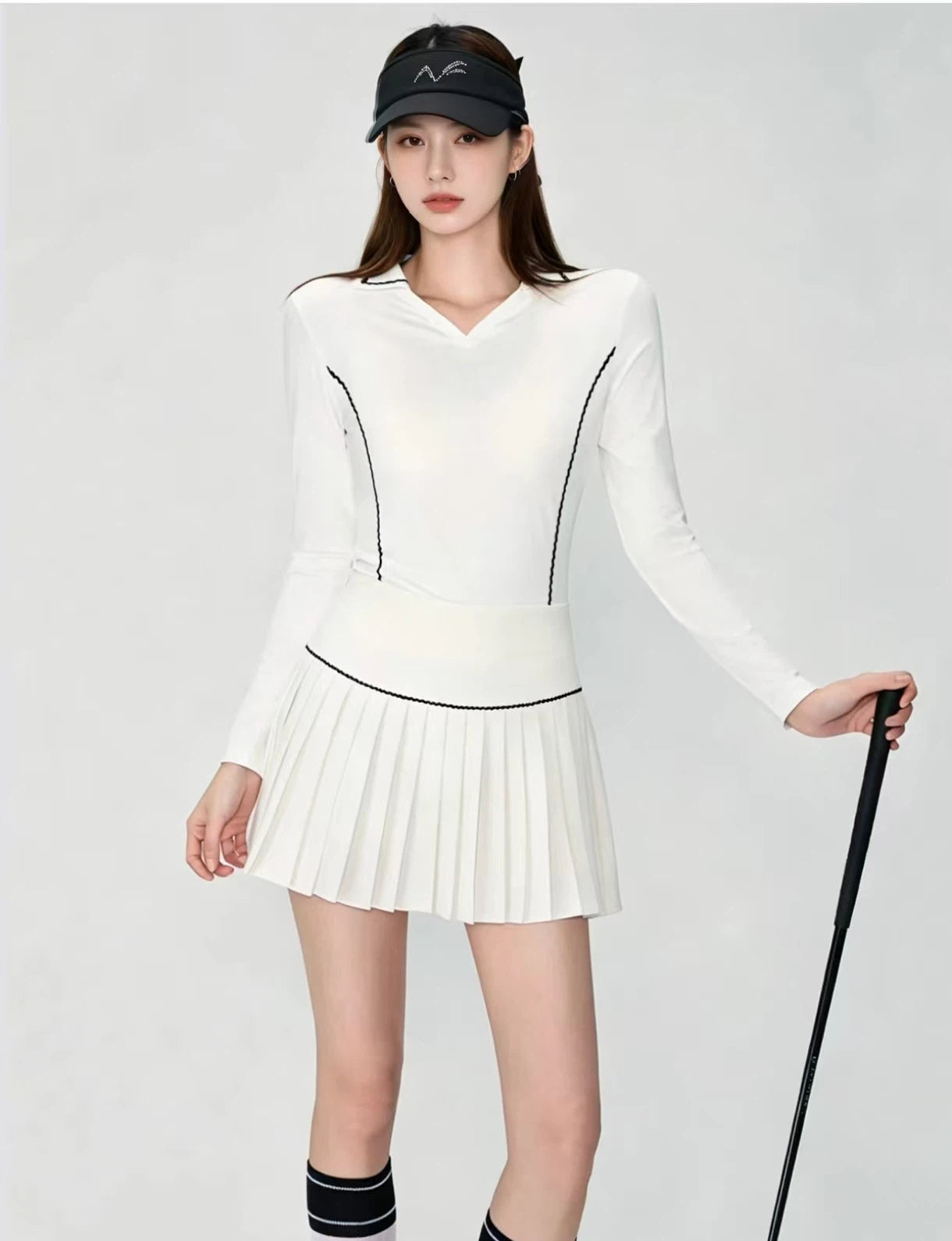 OZERO White golf shirt and pleated skirt set front view on model