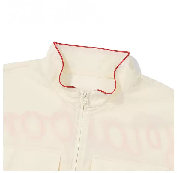 Malbon Women's Convertible Lightweight Golf Jacket Beige lightweight golf jacket detail view