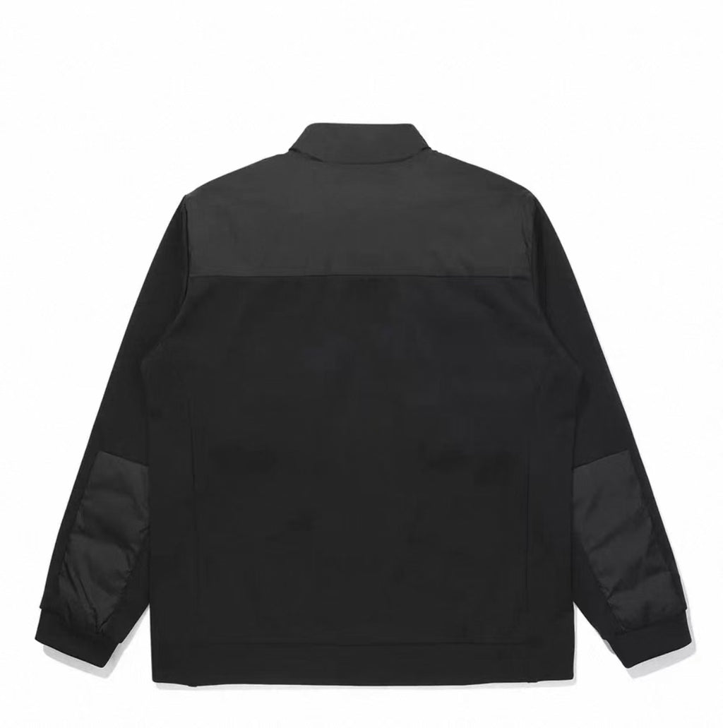 Malbon Preserve Hybrid Down Jacket Black hybrid down golf jacket model-wearing view