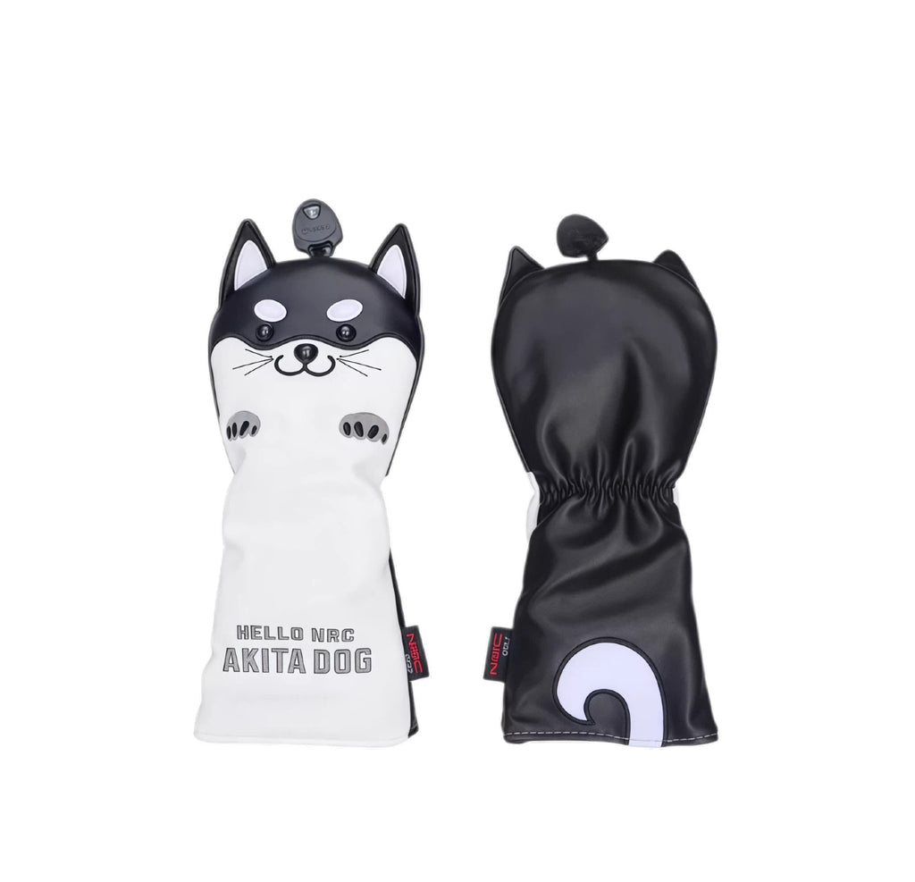 Front and back view of a black Akita Inu golf headcover showing the cute dog face with whiskers and paw prints on the front, and a curved white tail on the back — made from waterproof material with “HELLO NRC AKITA DOG” branding.