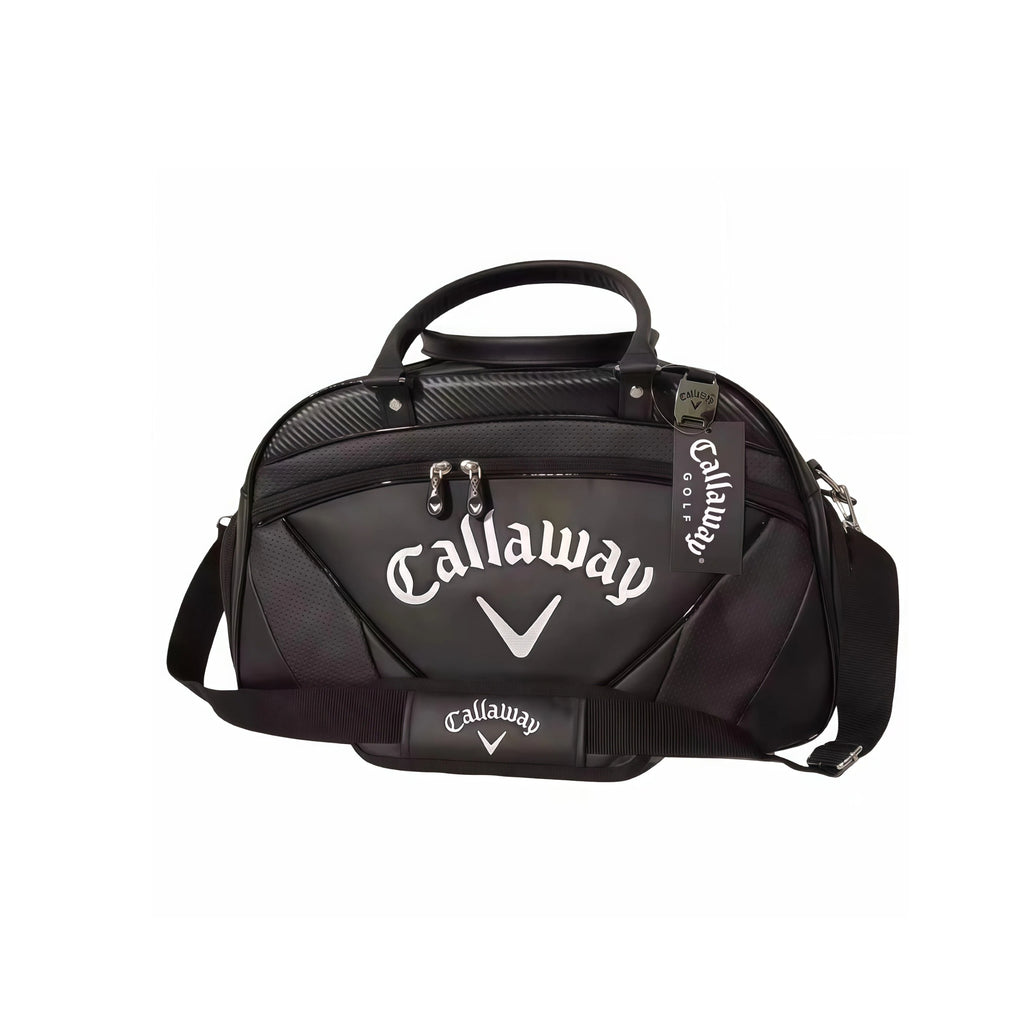 Black Callaway Exia Premium Golf Boston Bag with silver "Callaway" logo and carbon-fiber-style texture. Includes top handles, detachable shoulder strap, and brand tag. Designed for luxury and performance.