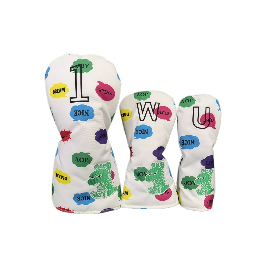 ：Graffiti canvas golf headcovers set including driver, fairway, and utility covers with white base, colorful bubbles, green dinosaur, and “1/W/U” lettering for full set protection.
