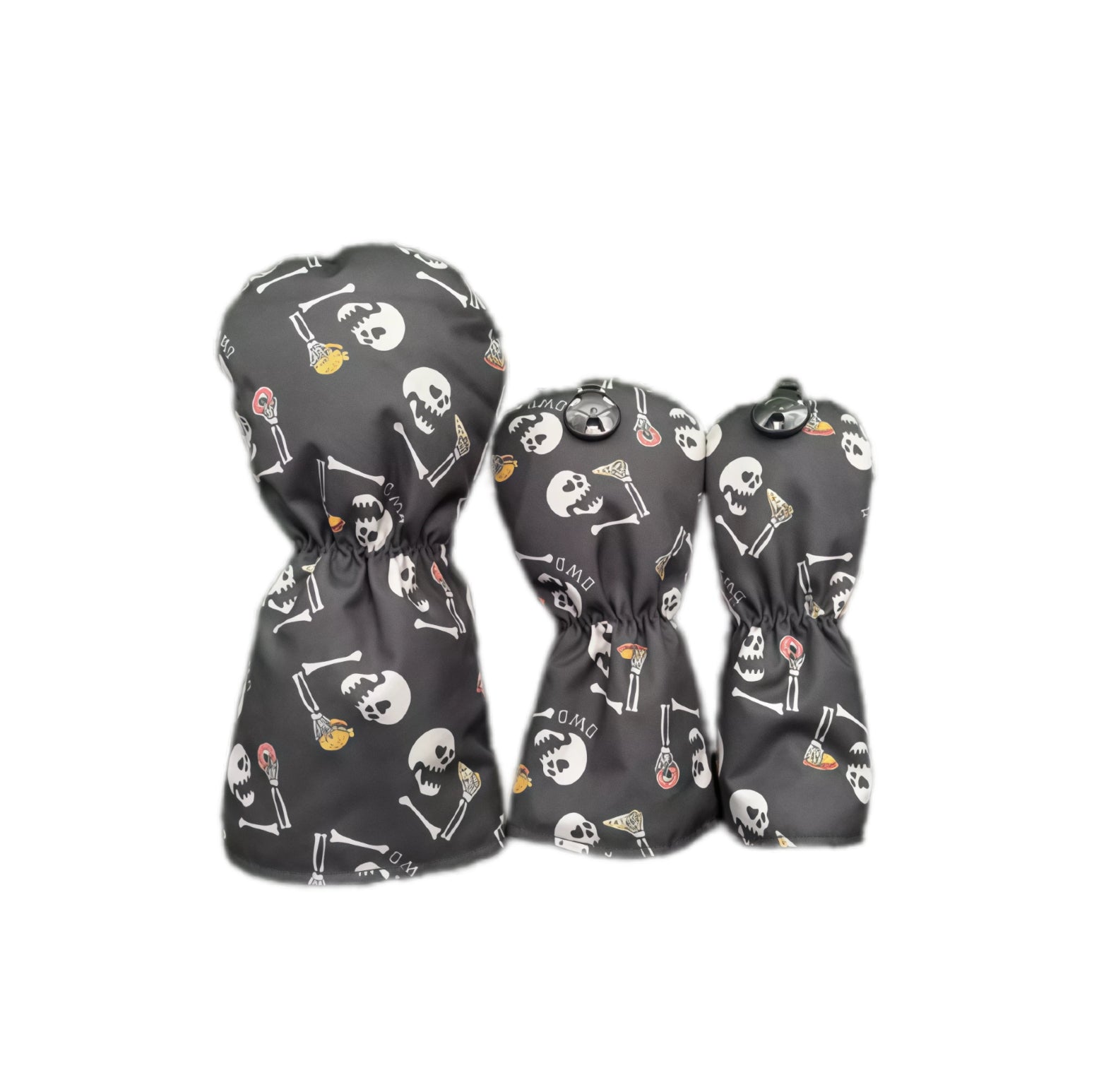 Back view of black graffiti flocked golf headcovers set showing elastic hem, metal snap button and repeating skull and bone print, compatible with driver, fairway and utility clubs for secure fit.