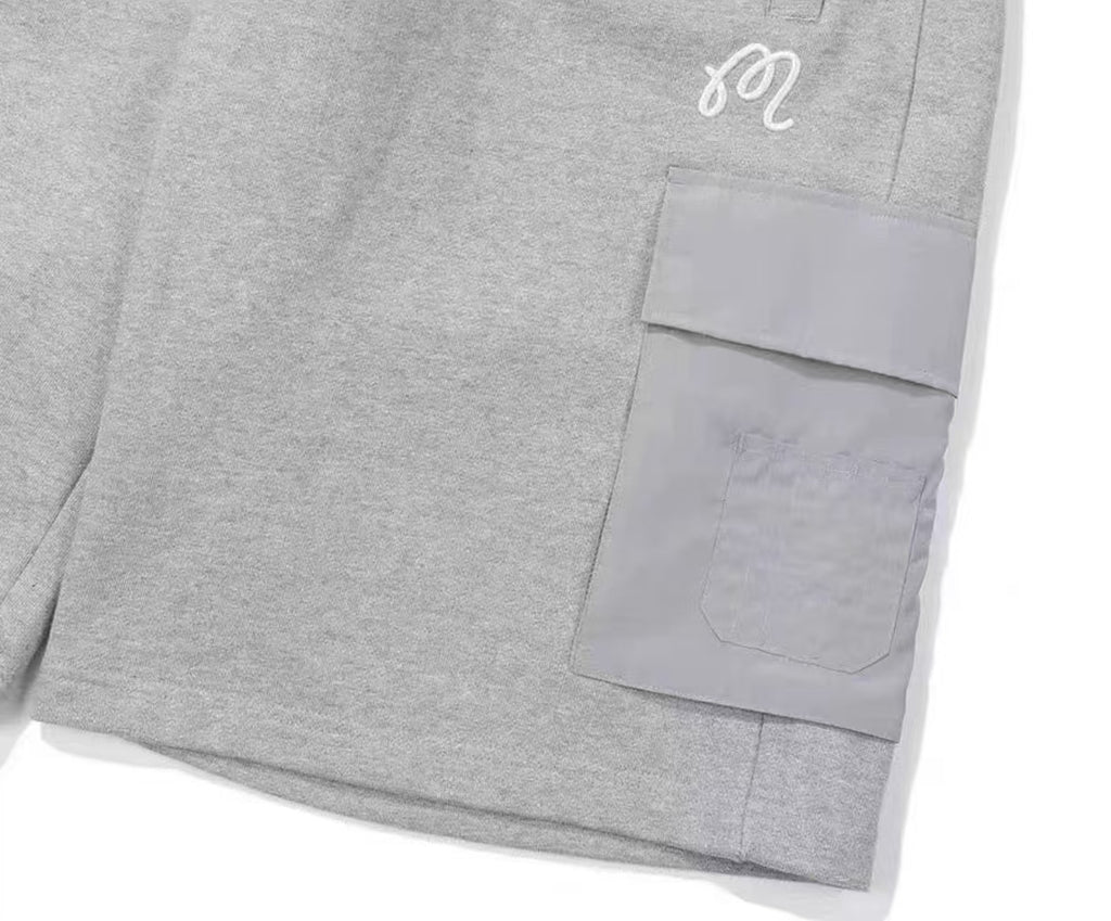 Malbon Men's Solid Embroidered Knit Shorts Grey knit golf shorts front view
