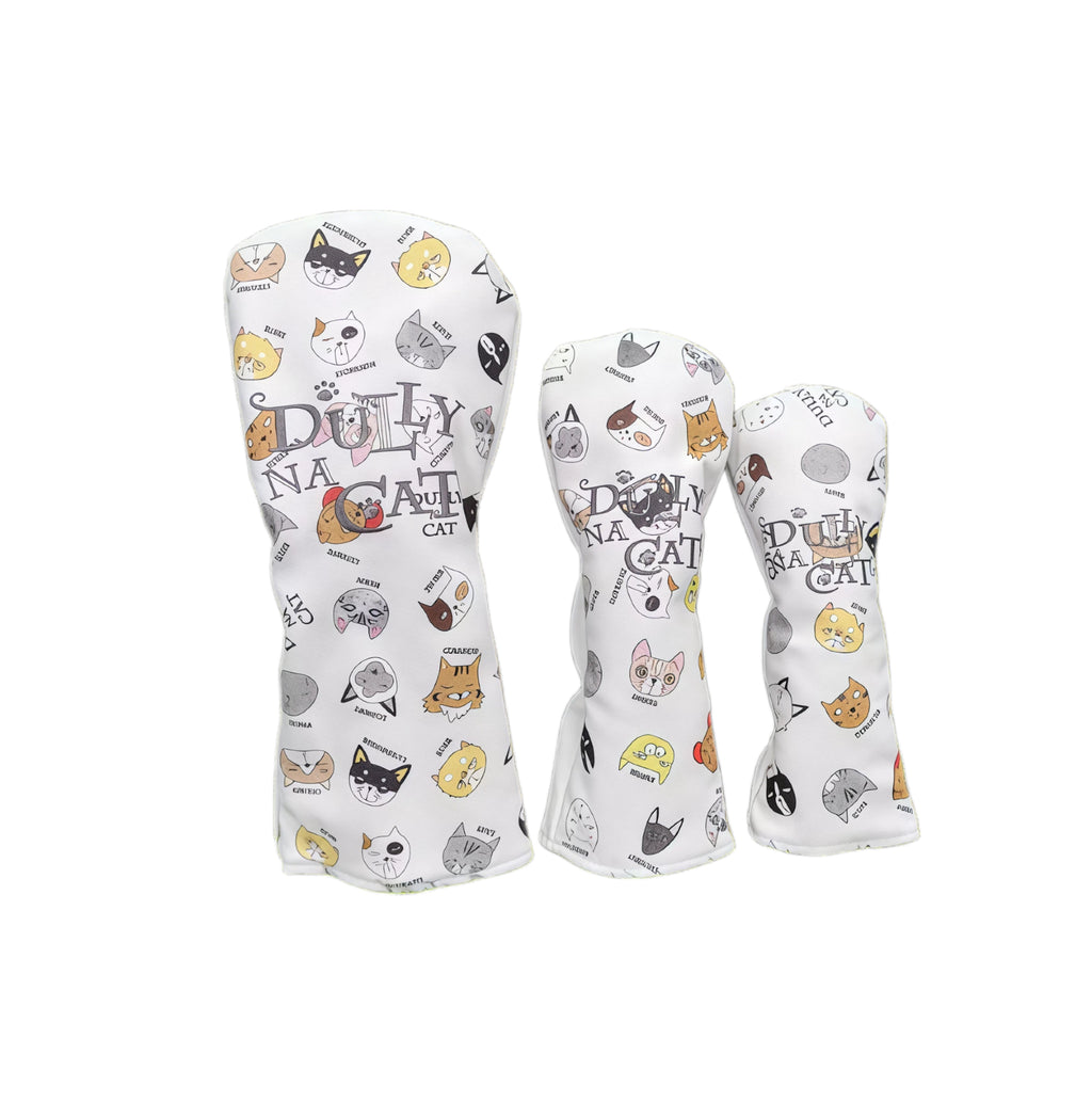 Lazy Cat cartoon golf headcovers set in white with DULLY NA CAT branding and multi-cat face patterns, suitable for driver, fairway woods and utility clubs.