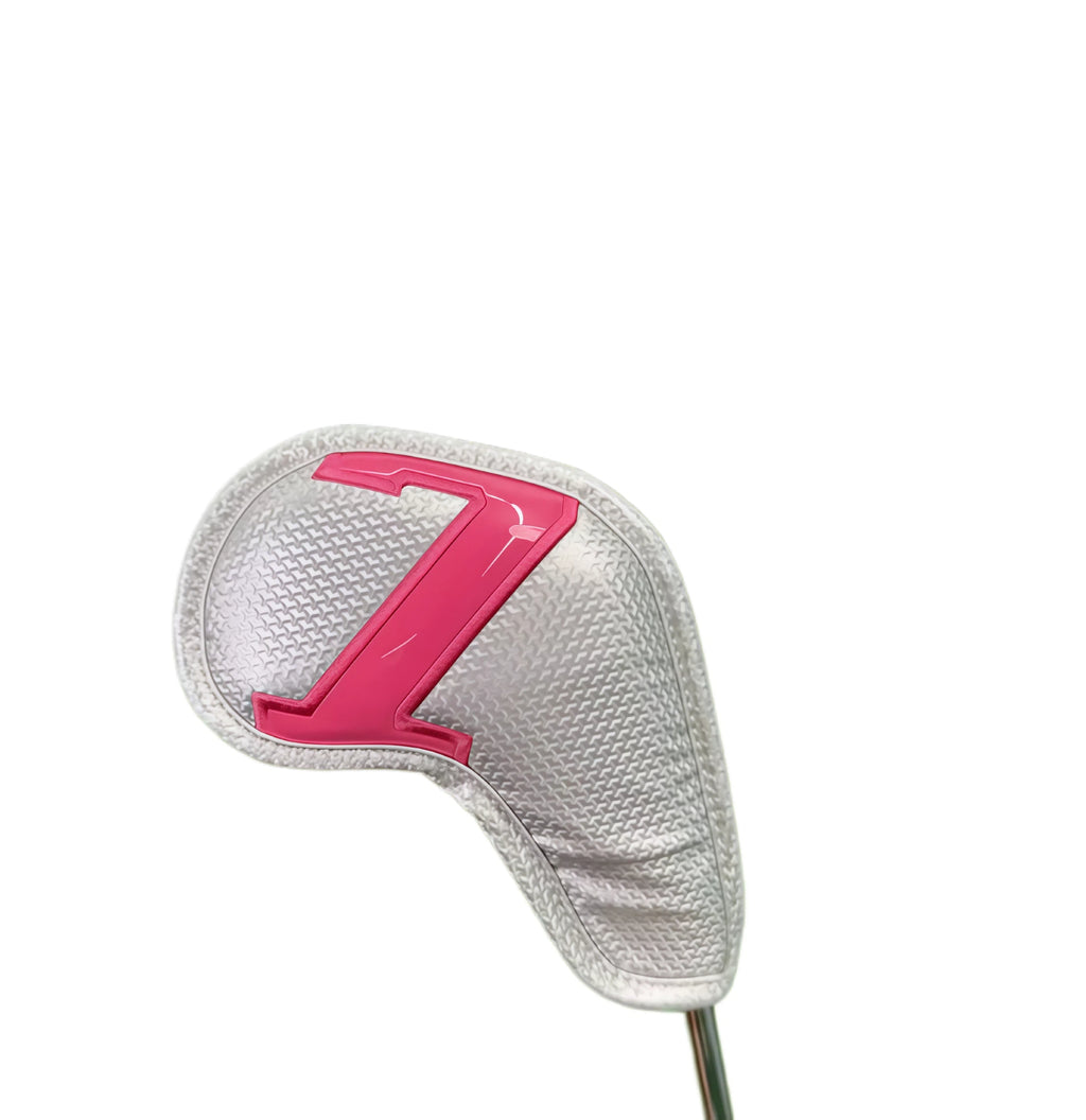 Close-up view of magnetic colorful number golf headcover with pink “7” digit on textured white PU leather, showcasing snug fit on iron club head and durable magnetic closure mechanism.