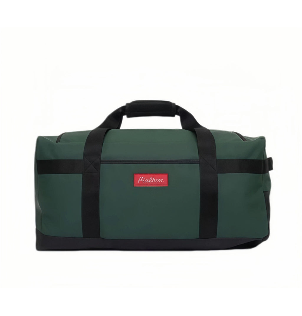 Clean front view of Malbon Golf "Buckets" duffle bag in forest green with black trim and red rectangular label displaying cursive "Malbon" logo, ideal for stylish travel