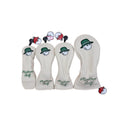 Four golf club heads with covers and Malbon Golf branding on a white background