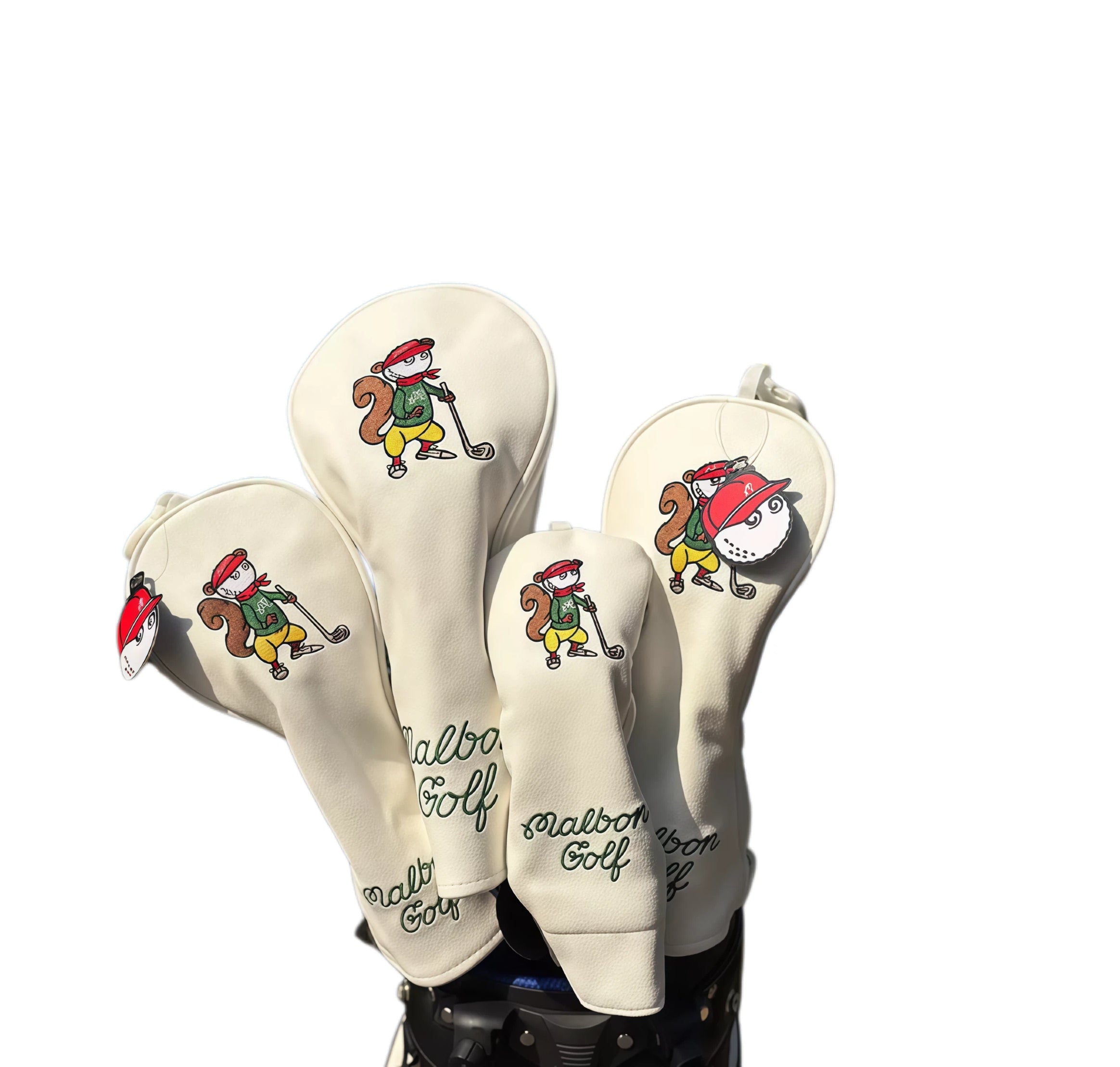 Beige Malbon Golf headcovers featuring adorable squirrel characters and detachable golf ball-shaped charms — crafted from waterproof PU with magnetic closure for easy use and fun personality on the course.