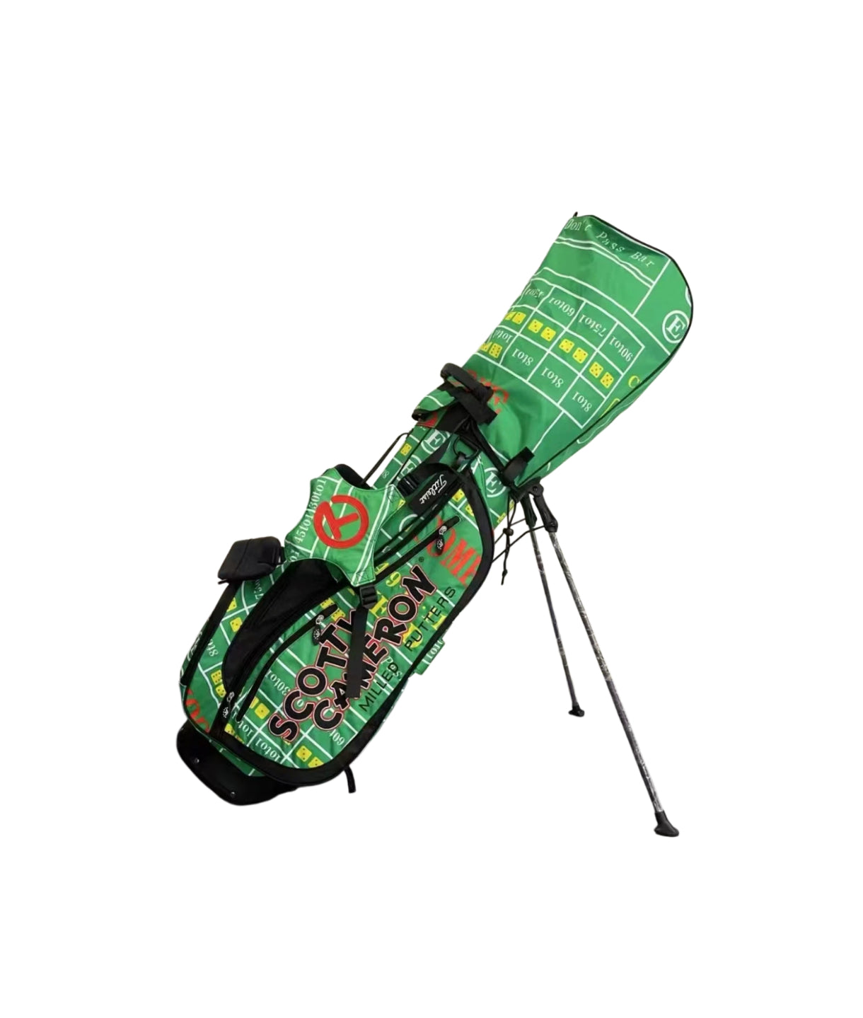 Angled view of the Scotty Cameron Gambler Stand Bag in vibrant green, featuring a unique craps table layout pattern, "SCOTTY CAMERON MILLED PUTTERS" text, and extended stand legs for stability.
