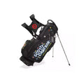 Black Scotty Cameron golf stand bag featuring bold "SCOTTY CAMERON MILLED PUTTERS" branding, colorful dot accents, dual straps, and built-in stand legs – ideal for professional golfers seeking style and function.
