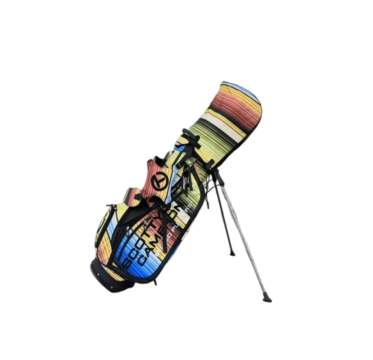 An angled view of the Scotty Cameron Pathfinder stand bag in a multi-color serape print, displaying the "SCOTTY CAMERON" branding and the bag's lightweight, portable design.