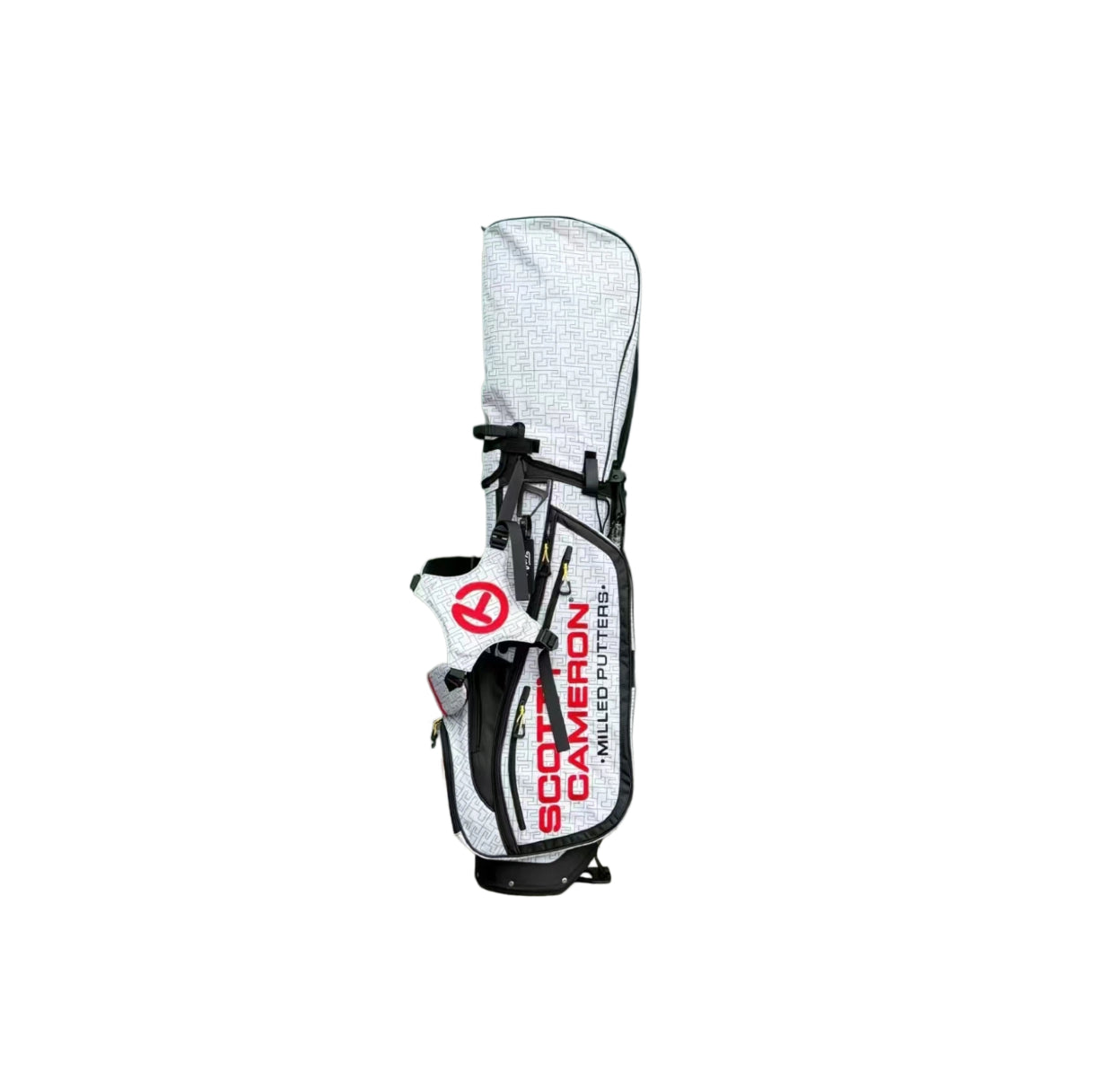 A top-down view of the Scotty Cameron SC Geo bag, showing the dual carry straps with red accents and the black structural backing. The geometric pattern covers the entire surface of the bag.