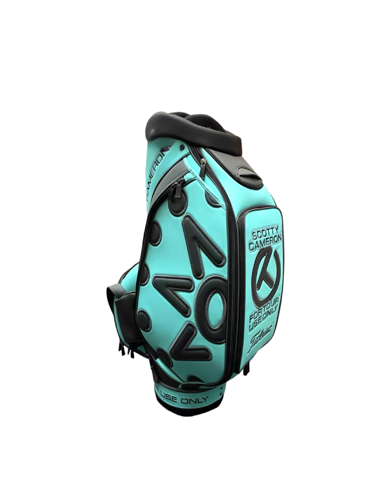 Side profile of the Scotty Cameron Scotty Blue Staff Bag showing the integrated grab handle, shoulder strap attachment points, and the Circle T branding.