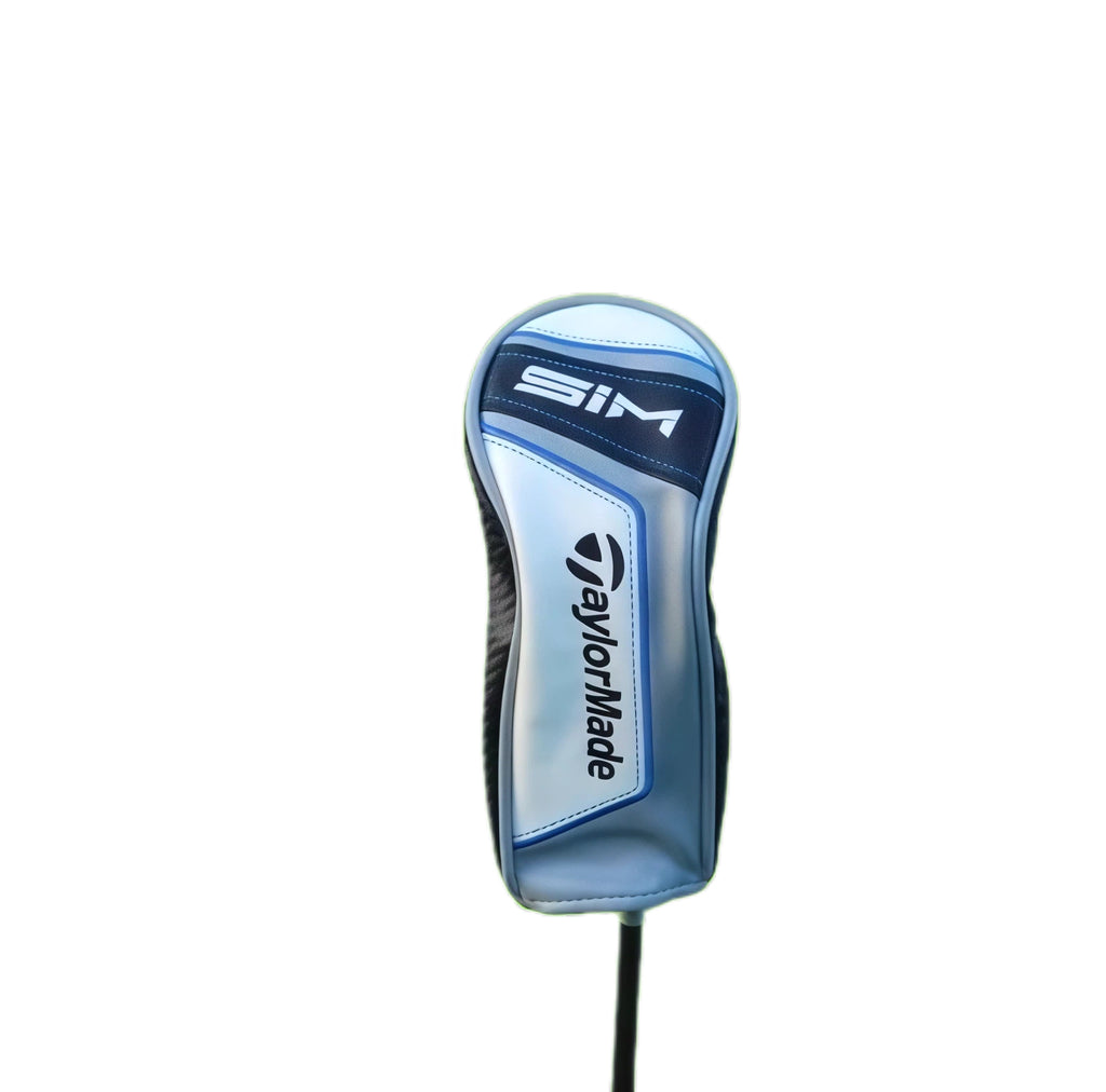 Close-up of a TaylorMade SIM Driver Headcover on a golf club shaft, showcasing the blue and black design with white stitching and brandin