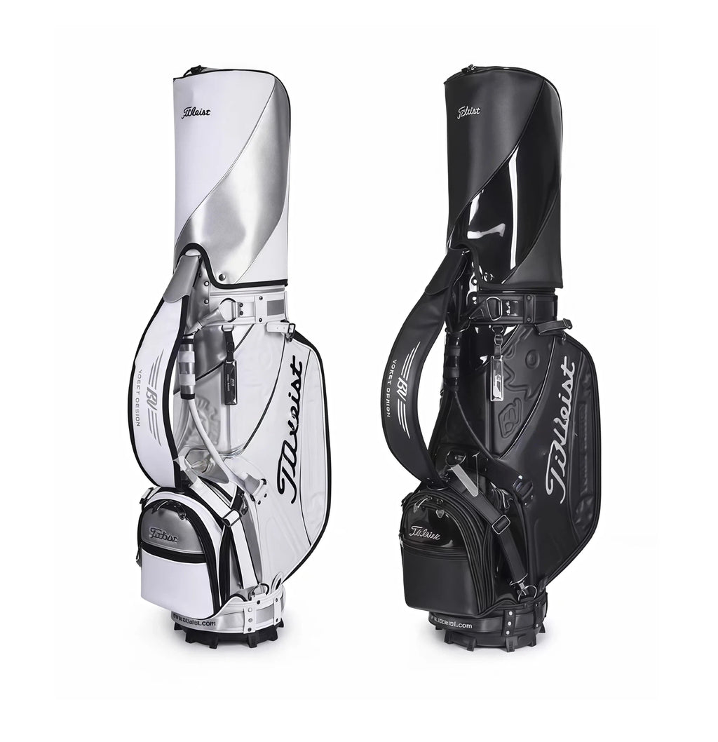 Side-by-side comparison of the Titleist Heritage Cart Bag in white/silver and black/glossy finishes. Both feature the "Titleist" script logo, Vokey Design elements, dual straps, and reinforced base. Choose your preferred style.