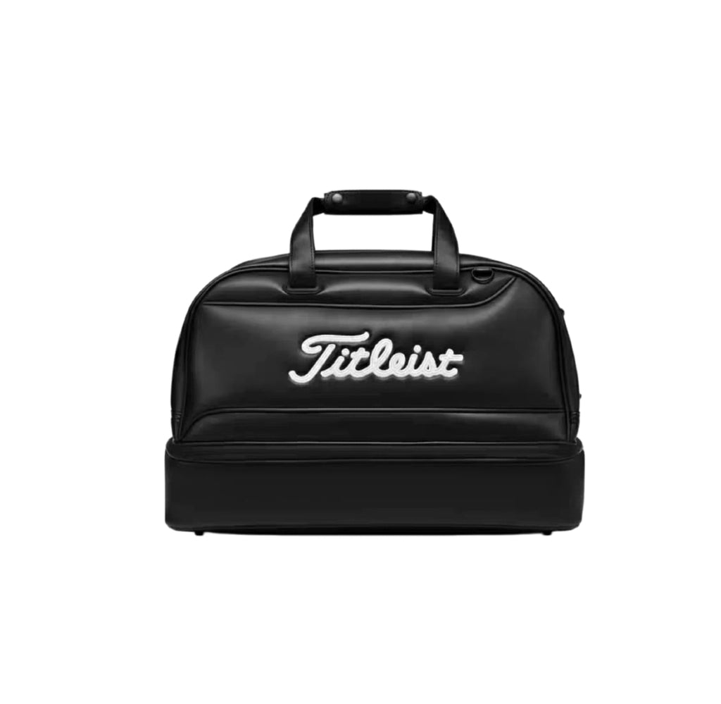 Front view of the black Titleist Shoe Bag with contrasting white "Titleist" script logo. Features a dual-compartment layout, top handles, and a sleek, durable design for golf and travel.