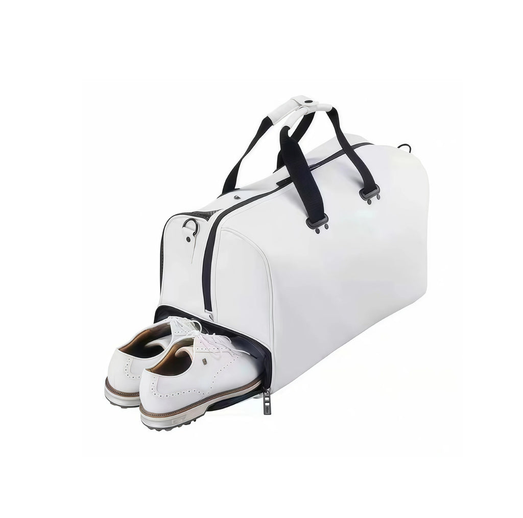 White Titleist Tech Duffel with open shoe compartment showcasing a pair of white golf shoes. Ideal for keeping footwear separate and organized during travel or golf outings.