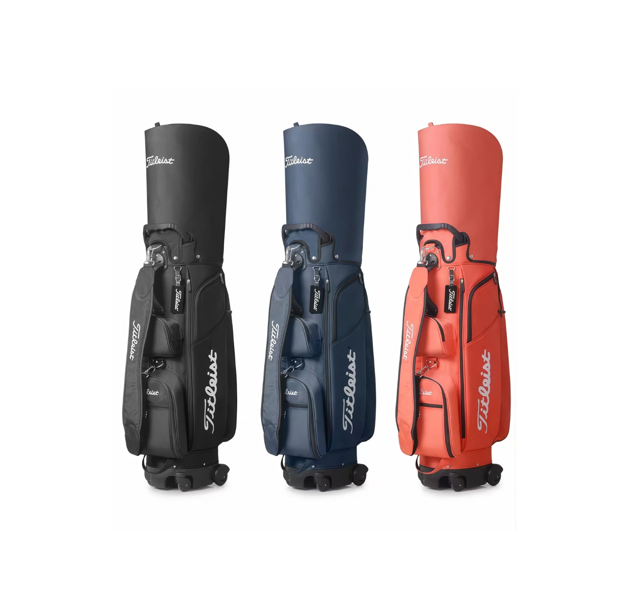 Full front view of three Titleist Travel Trolley Bags standing upright: black, navy blue, and coral red. Each features dual wheels, padded straps, and prominent "Titleist" logos. Perfect for travel and daily use.
