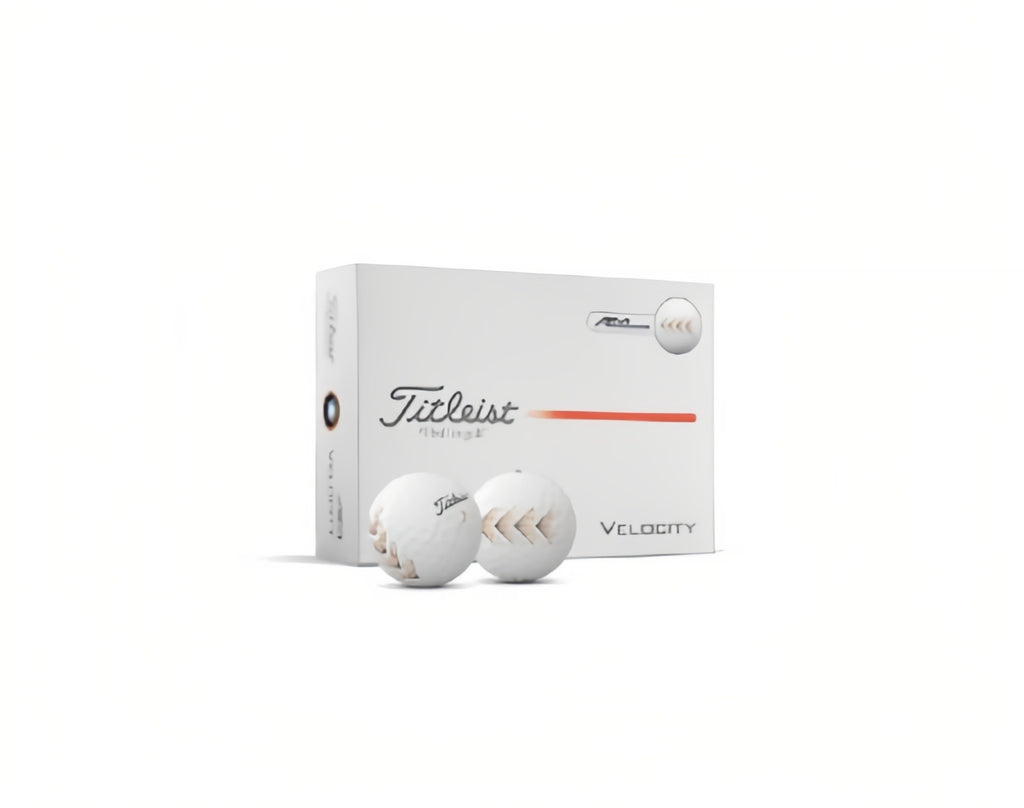 Titleist Velocity 2026 golf balls in white packaging. The box features the Titleist logo and orange accent line, displayed with two white Velocity balls showing the alignment arrow graphic.
