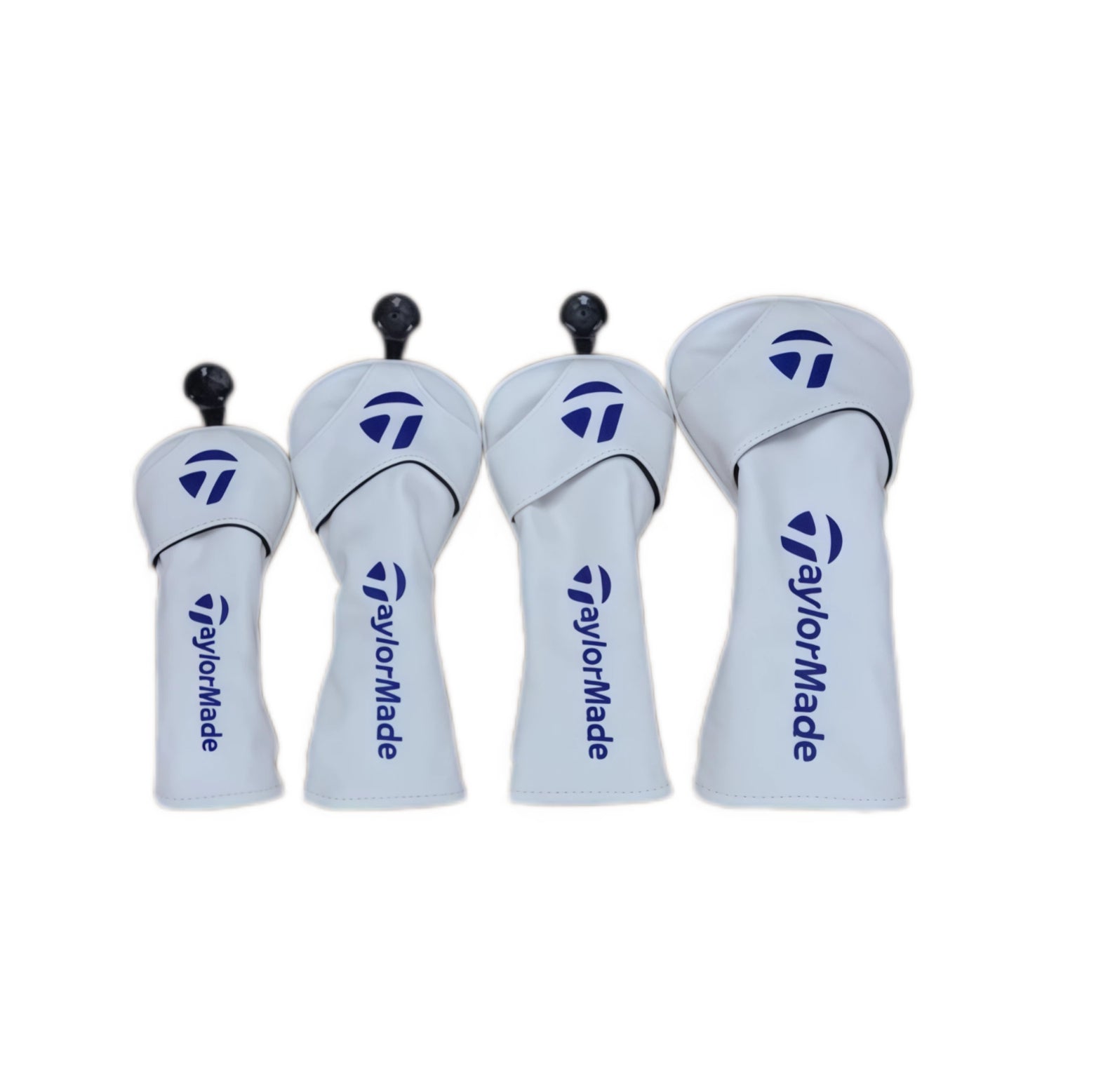 Four white universal golf driver headcovers designed to fit TaylorMade woods — each features black TaylorMade “T” logo on top and vertical brand text down the side, with elasticized opening for snug fit.