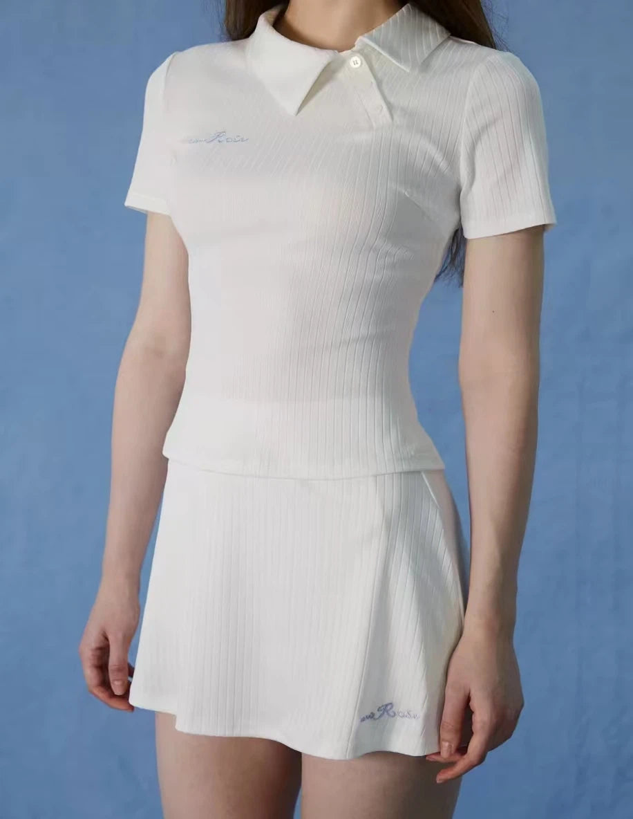 NowRose White asymmetrical golf polo and skirt on model