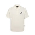 Model wearing Malbon men's black dot print golf polo